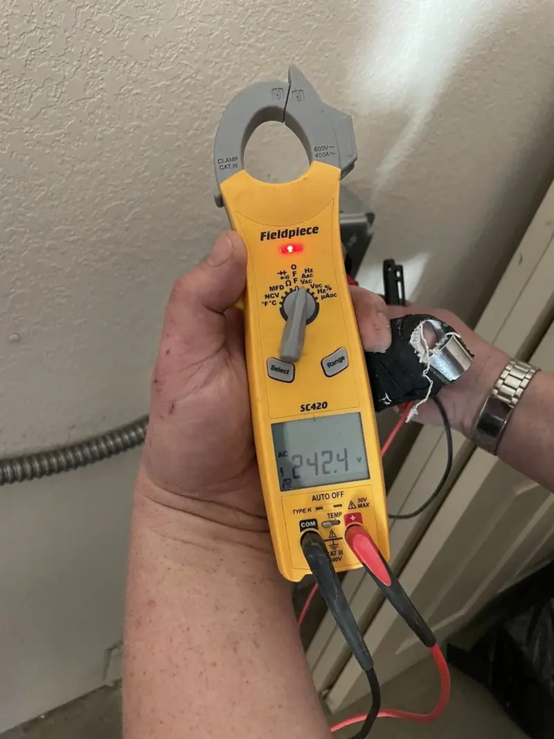 Voltage testing with clamp meter during Hot Tub / Pool Electrical Wiring in Olivette